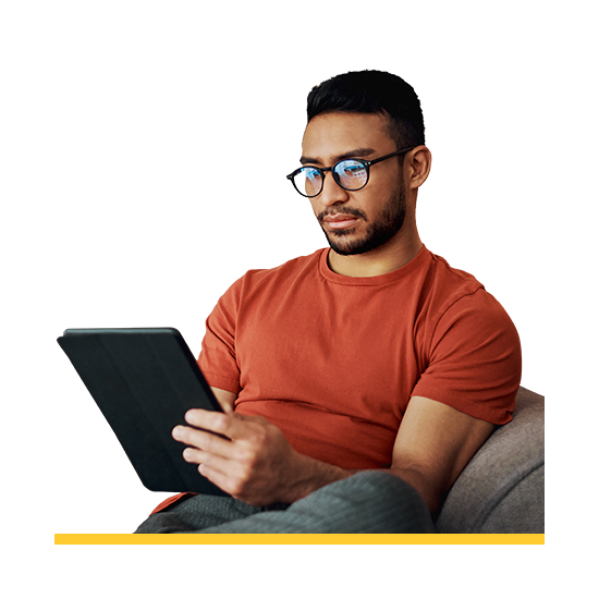 man with grey hair and beard holding tablet