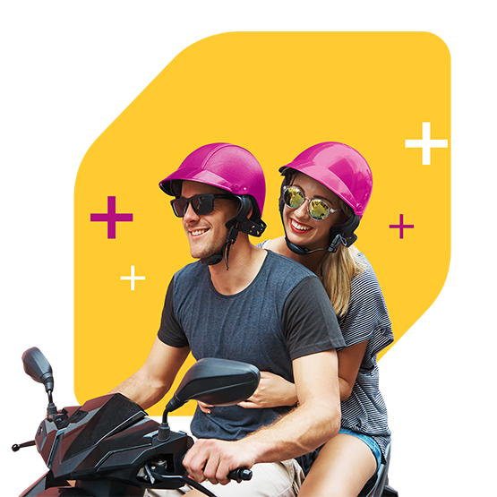 Couple on moped wearing sunglasses and matching pink helmets