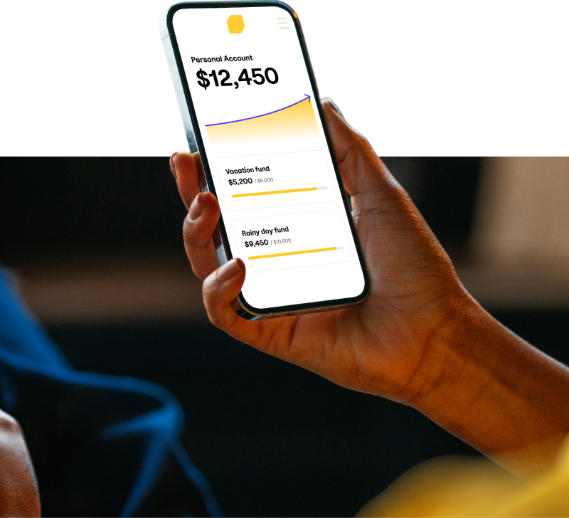 An image of a phone in a person’s hand. On the screen is a simplified view of the EQ Bank app, with a graph showing    a steady increase over time, and 3 accounts with various amounts of savings in them.